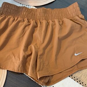 Nike Women's Tan Athletic Shorts with White Swoosh